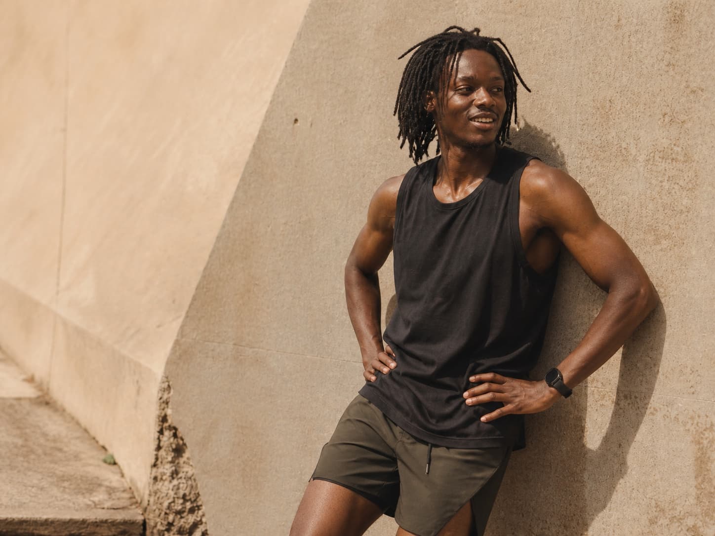 Runner resting against a wall